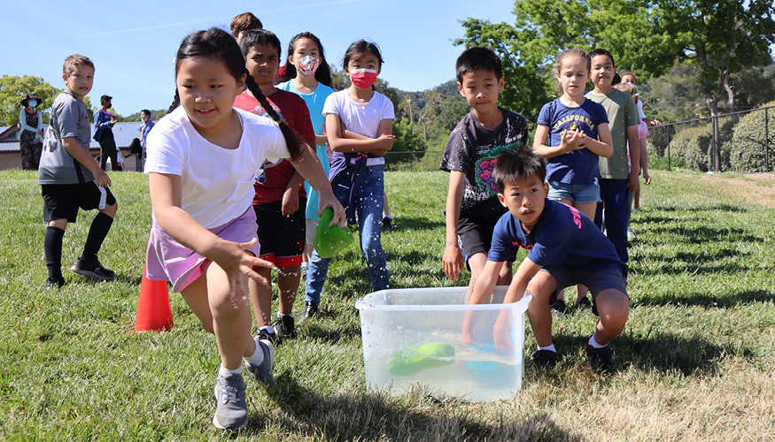 Smiling Challenger elementary students enjoying Field Day