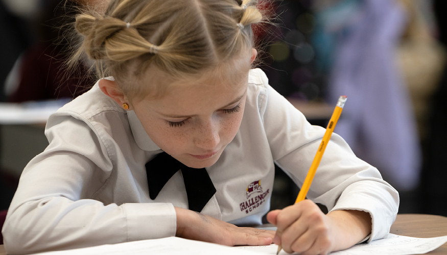 Focused elementary Challenger student writing
