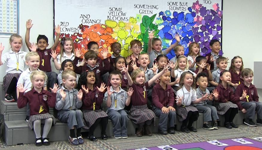 Smiling Challenger kindergartners performing during Spring Program