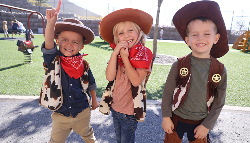 Three happy Challenger students dressed up for Western Days