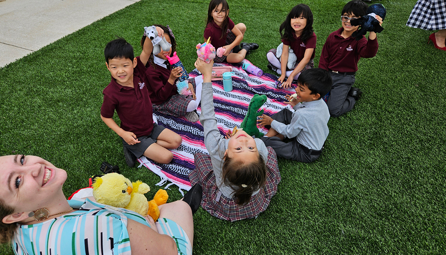 Challenger students enjoying Teddy Bear Picnic outside