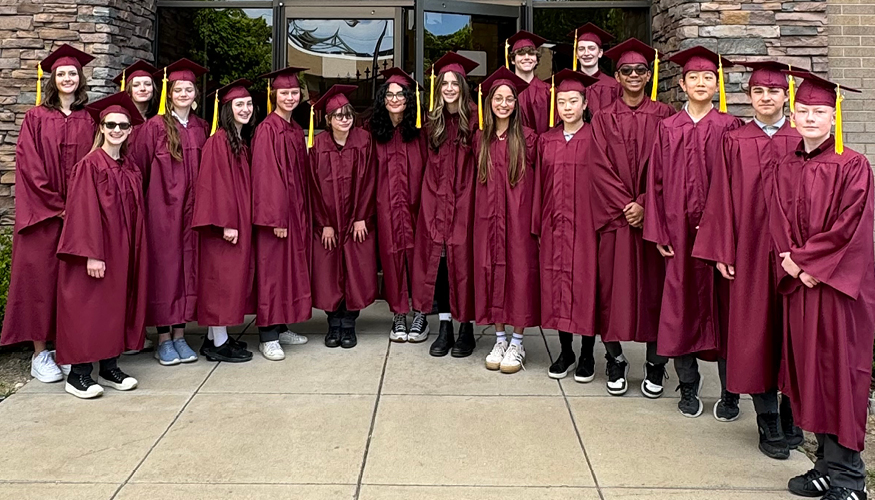 Challenger graduates wearing their cap and gown